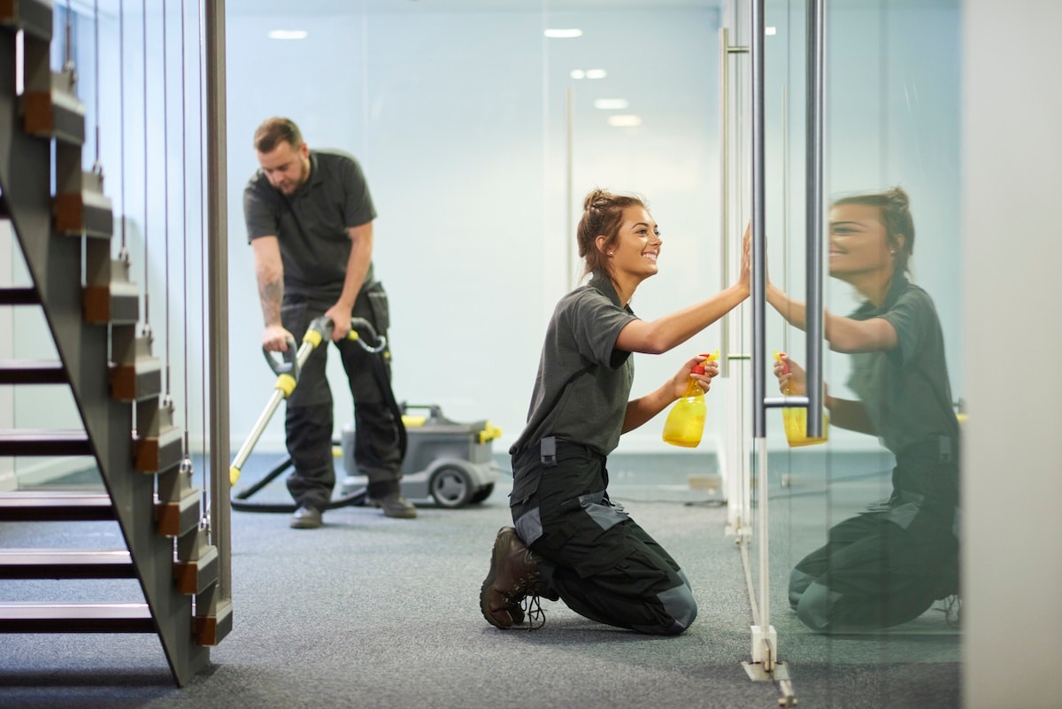 Day Porter team Image cleaning carpet and glass (1)