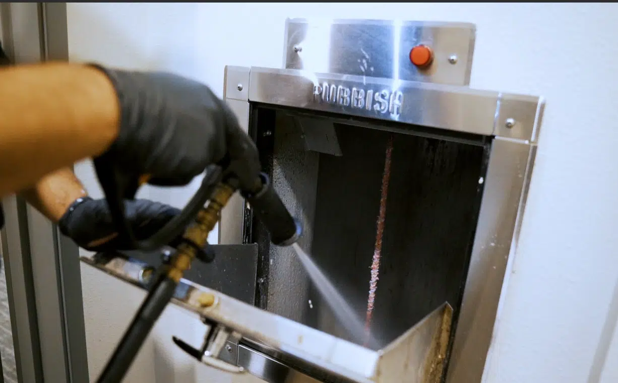 The Public Health Side of Trash Chutes: How Trash Chute Cleaning Stops the Spread of Bacteria & Odor A trash chute being power washed