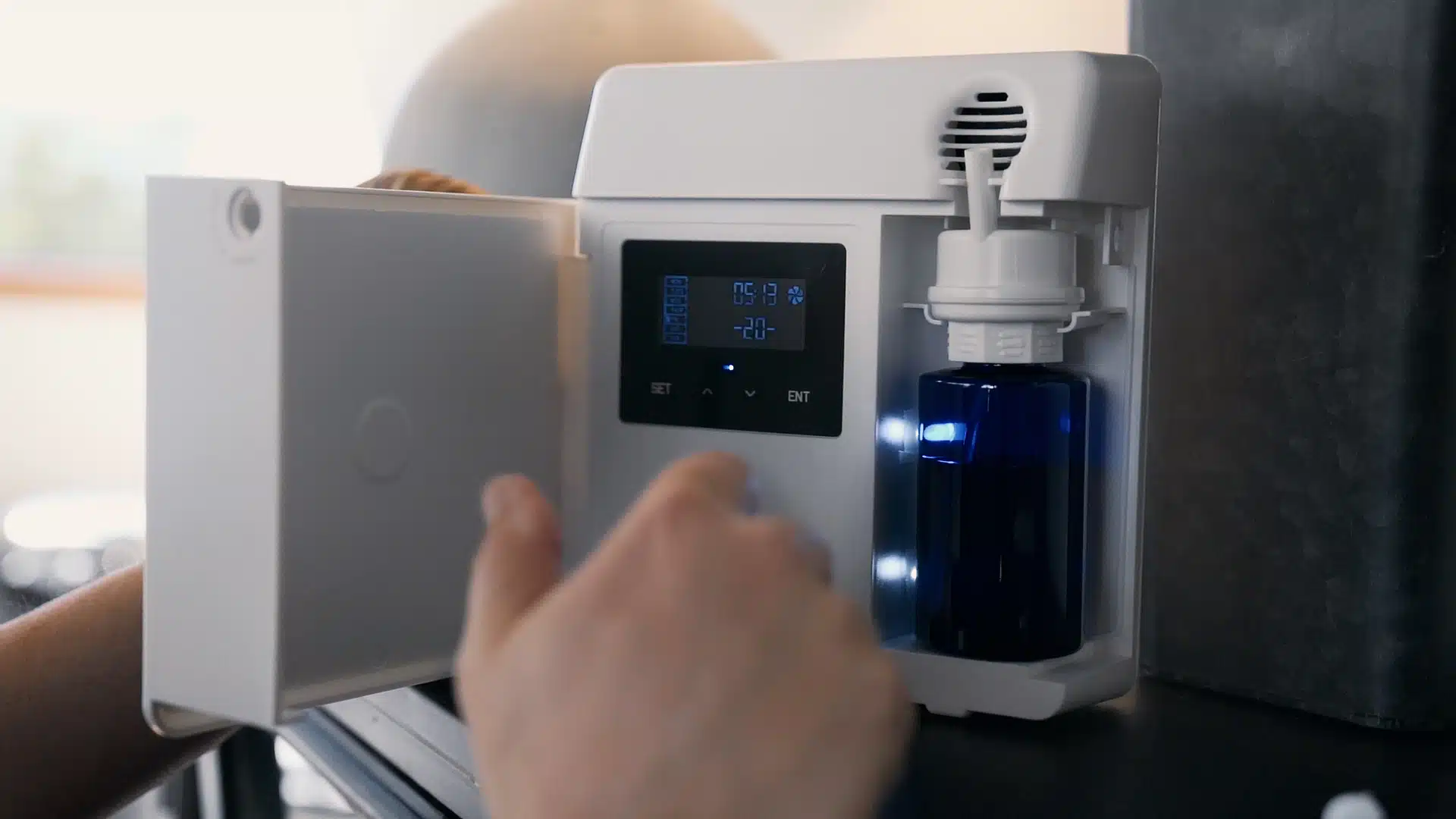Scent Branding for Businesses: Creating Consistent Customer Experiences Across All Locations Person working on a Fikes scenting machine