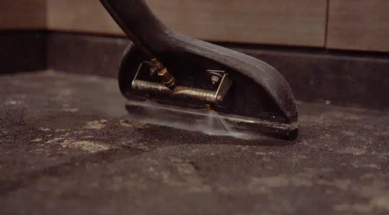 Summer Deep Cleaning Services: Rescuing High-Traffic Restrooms from Mid-Year Slump close up shot of a tool for deep cleaning commercial building floors