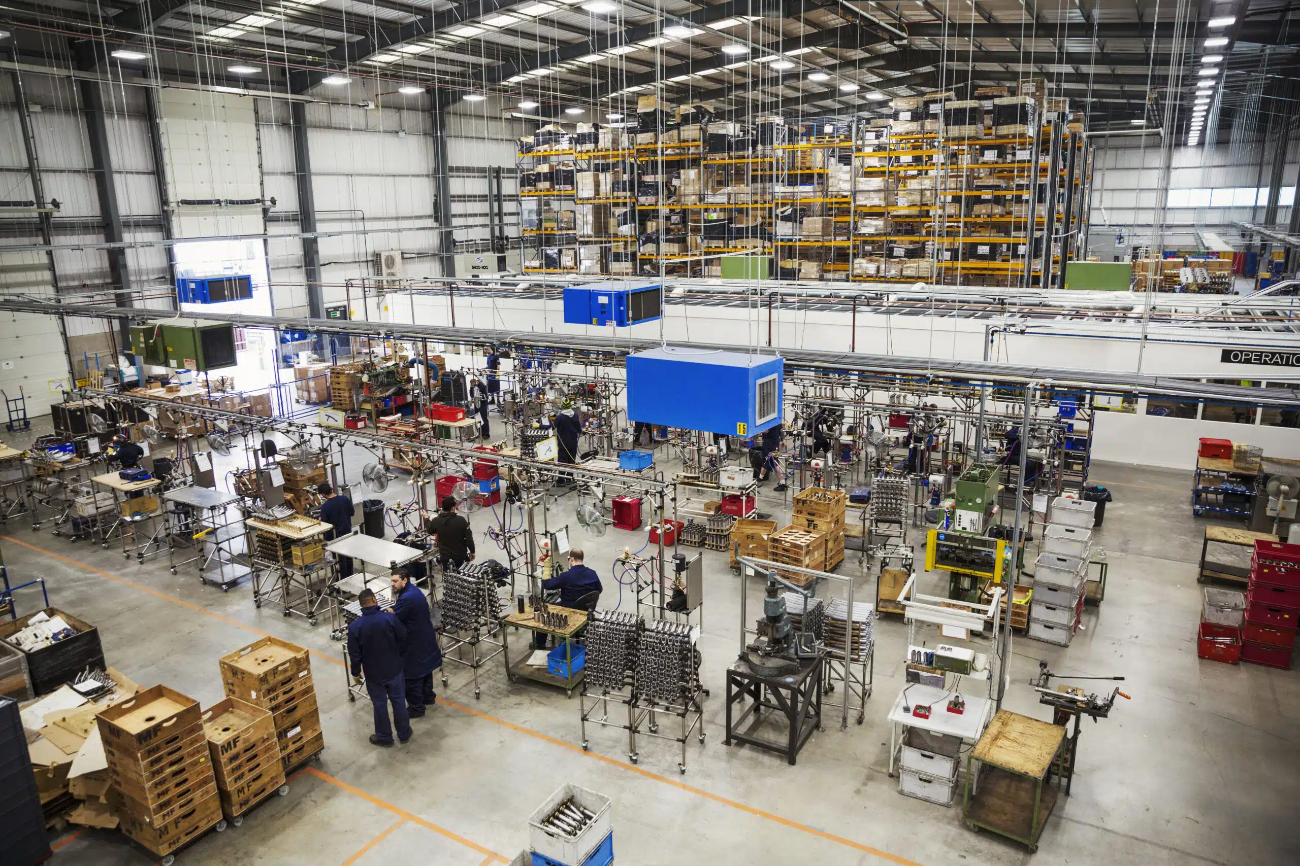 Facility Cold and Flu Prevention: Properly Preparing Manufacturer Restrooms High angle view over the factory floor and assembly process in a bicycle factory | facility cold and flu prevention